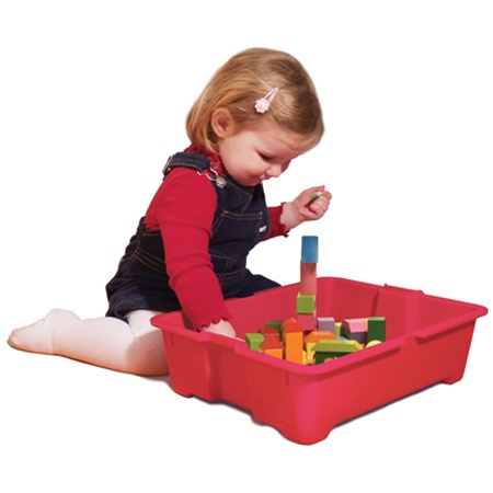 Child Playing with blocks in red toy bin